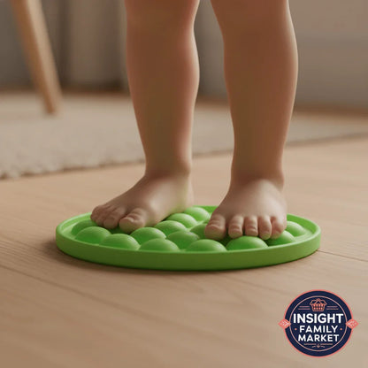 Child standing on green sensory balance pad for sensory support and calm