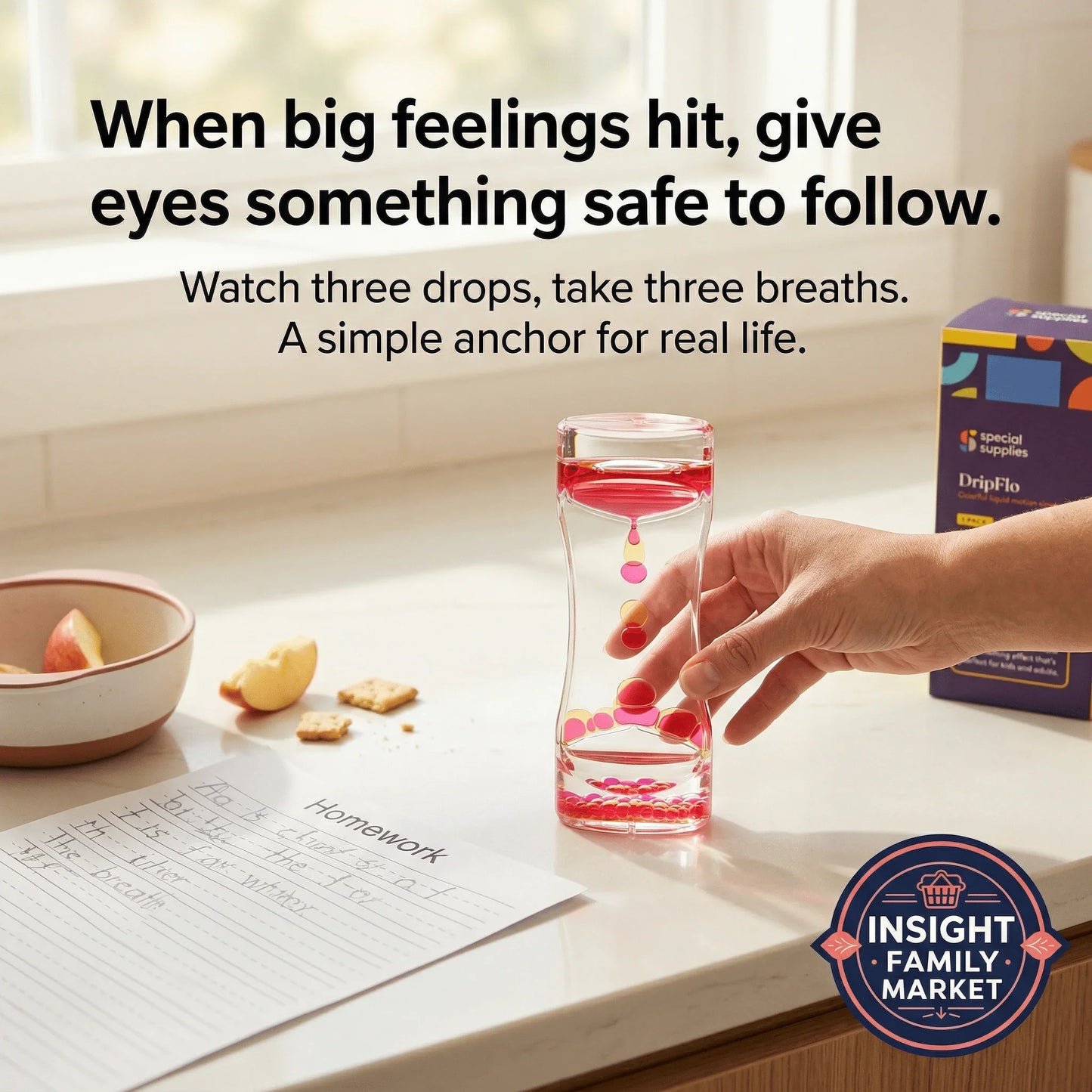 Hand using sensory liquid timer for focus, with homework and snacks on kitchen counter