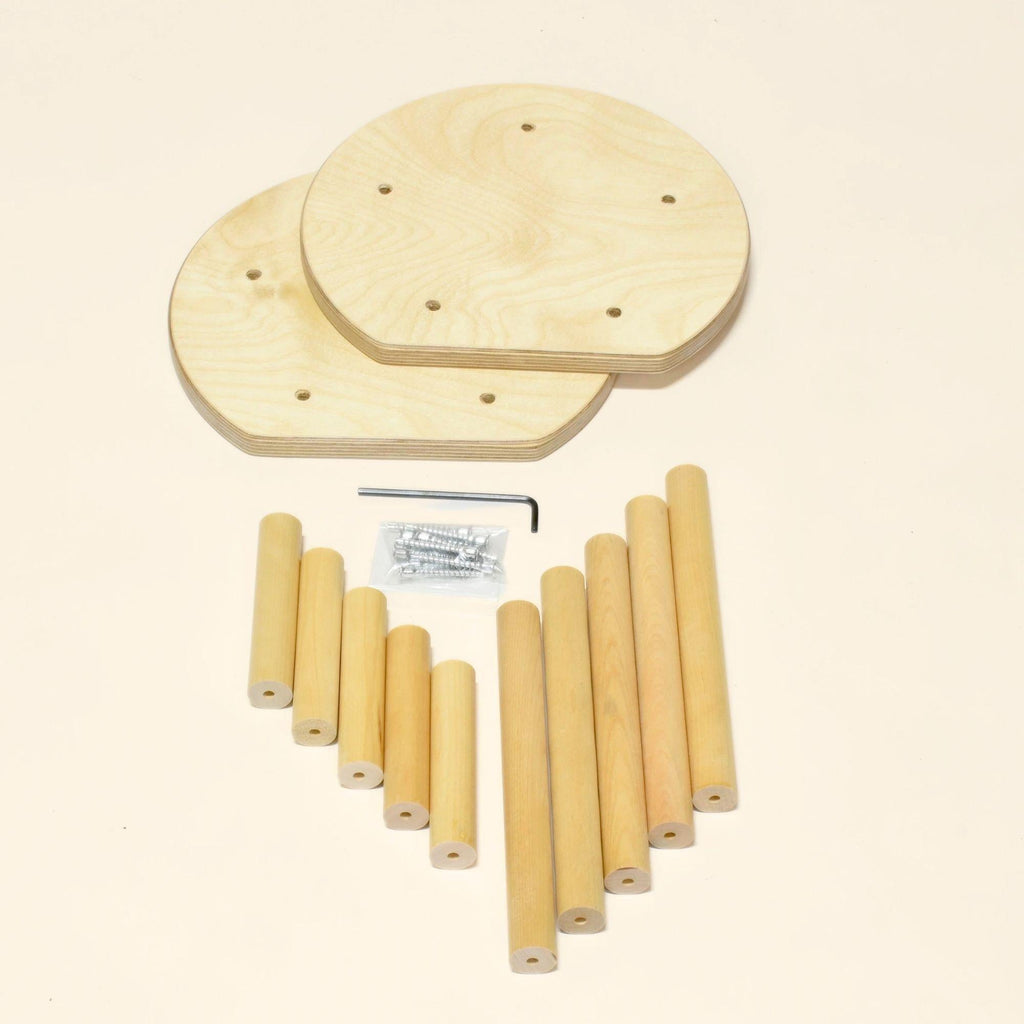 Wooden dowels and circular wooden pieces on a beige background
