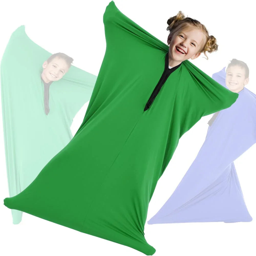Child in a green sensory body sock stretching, ideal for sensory play and vestibular input.
