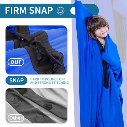 Child in a blue sensory swing comparing strong snap closures with soft fabric, sensory support