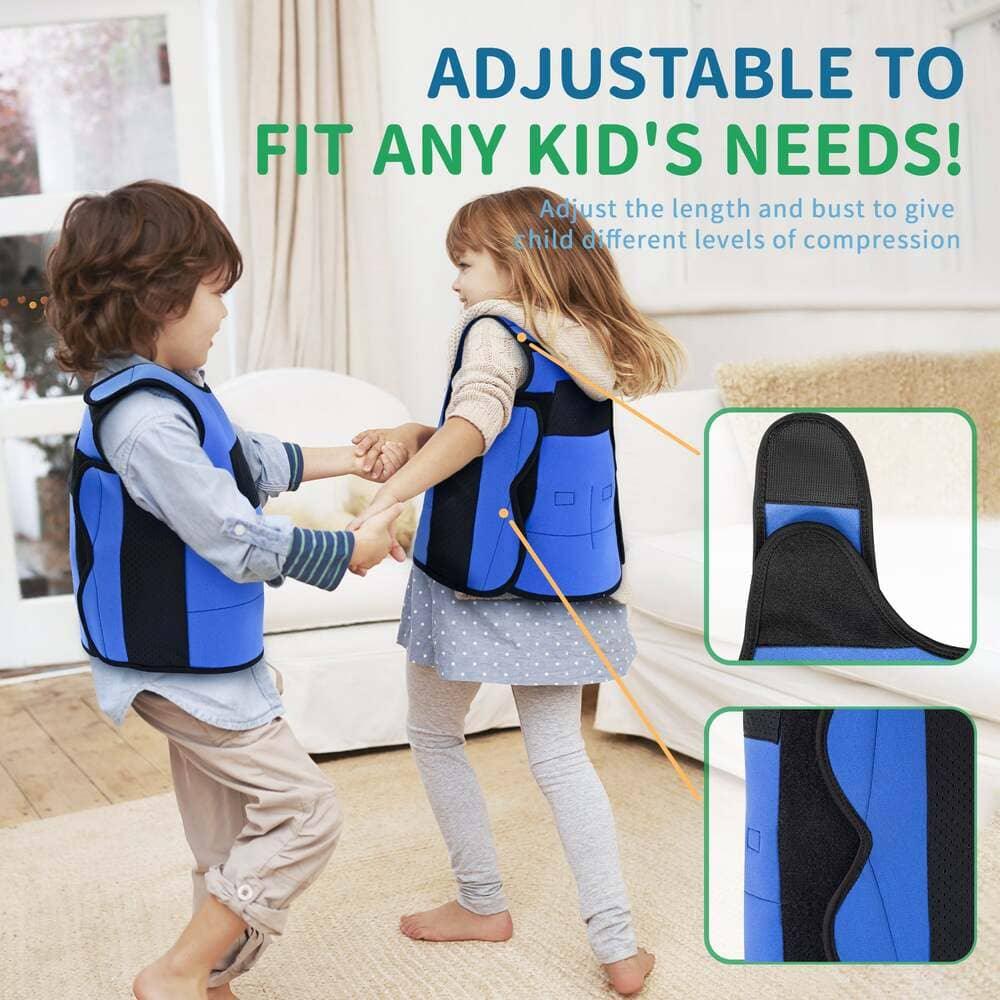 Two children wearing blue adjustable sensory compression vests playing indoors
