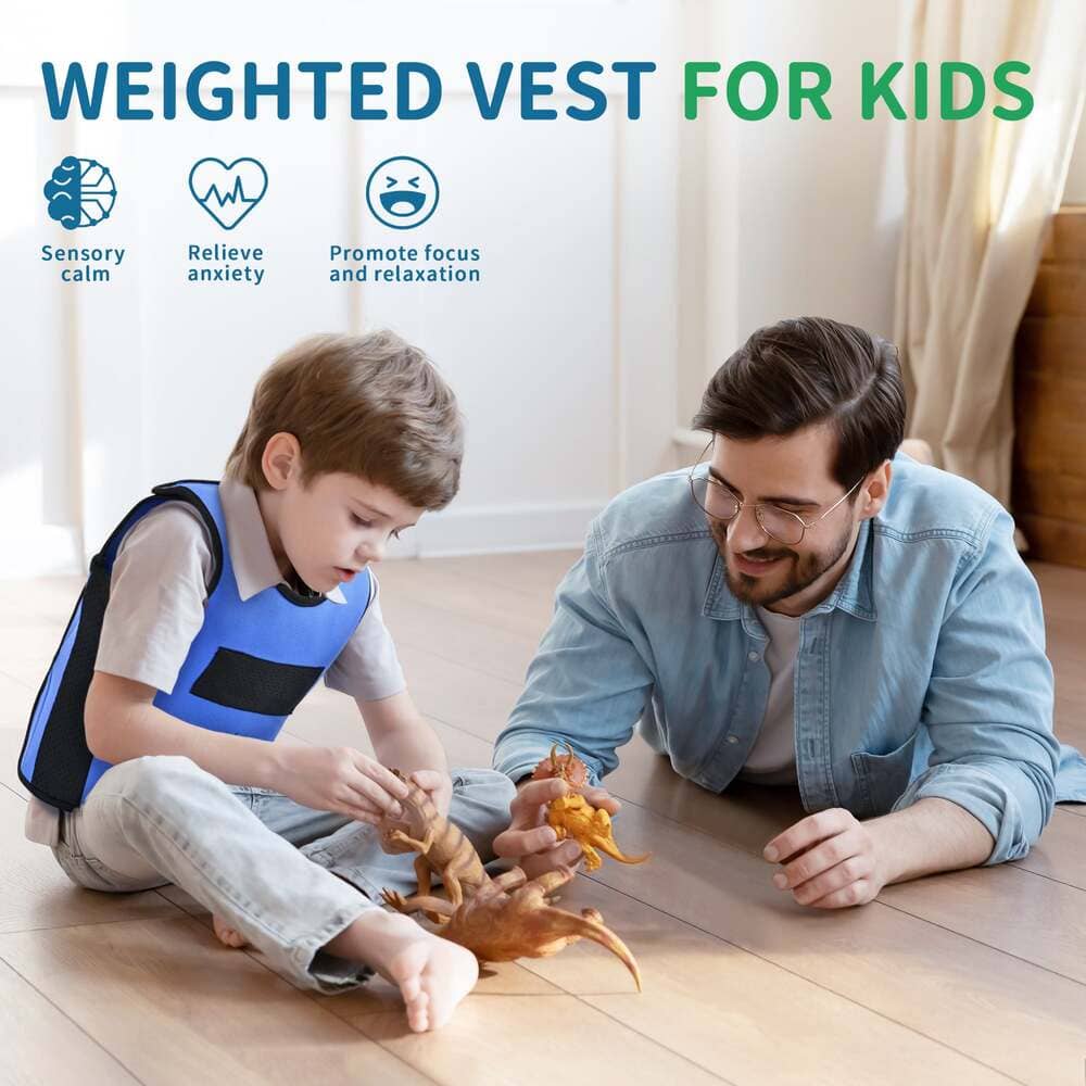 Child wearing a blue weighted vest playing with a toy on the floor with an adult.
