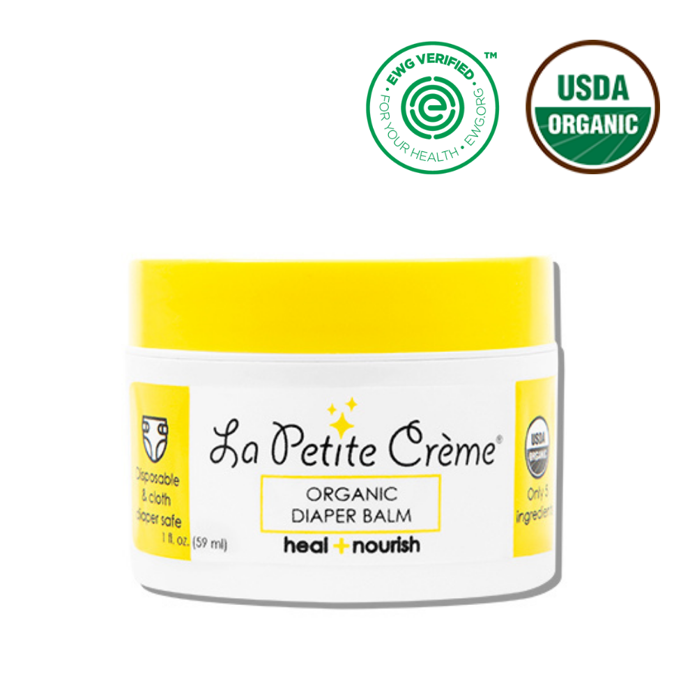 La Petite Crème organic diaper balm jar with certification logos on a white background