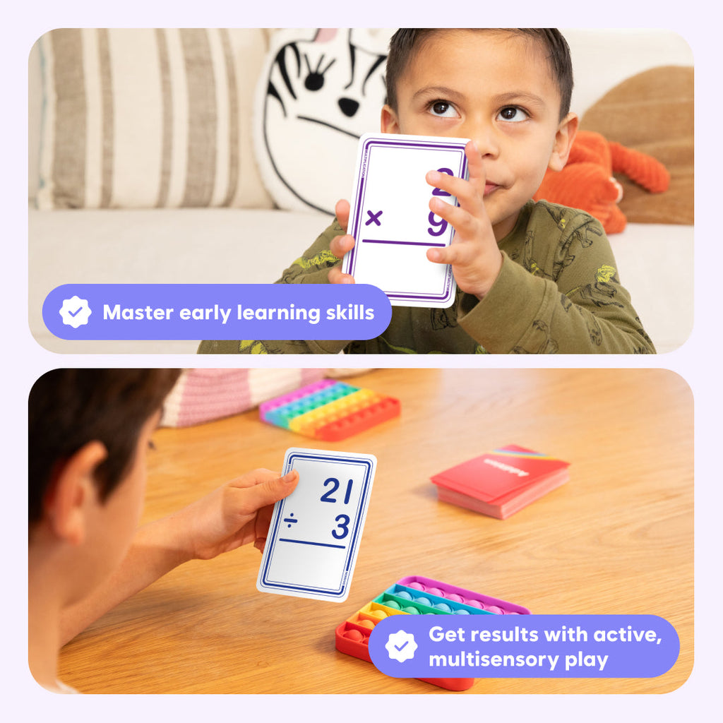 Child holding a math card with educational text, surrounded by colorful learning materials.