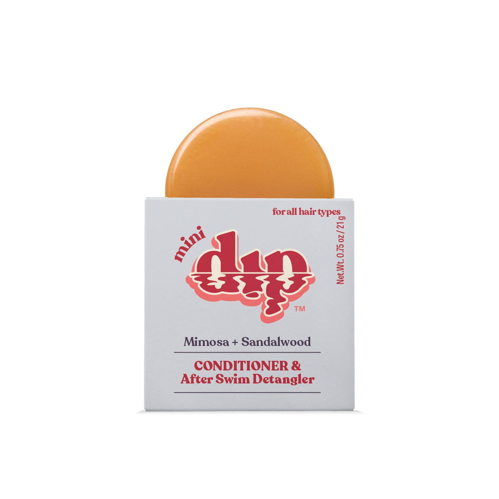 Bar of soap with a white box labeled 'mini dip' on a white background