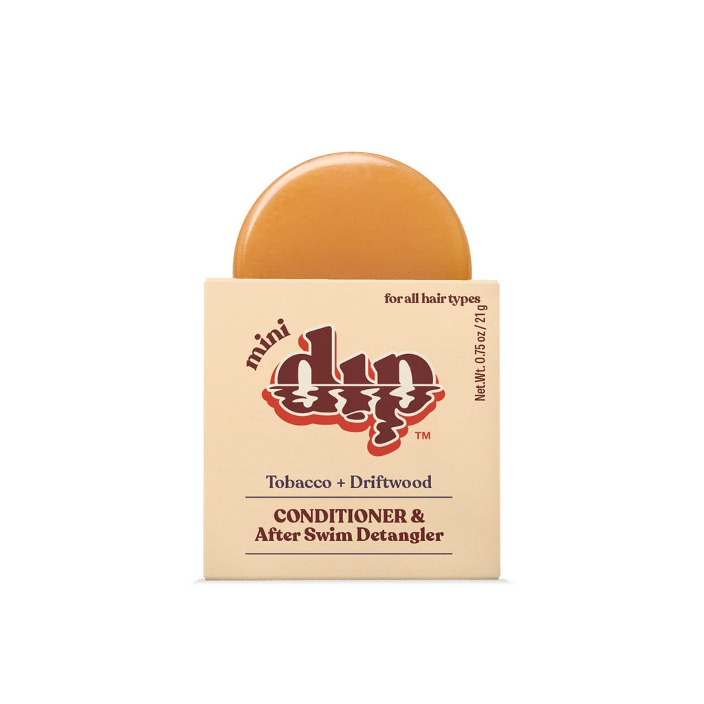 Bar of soap with packaging labeled 'mini dip' on a white background