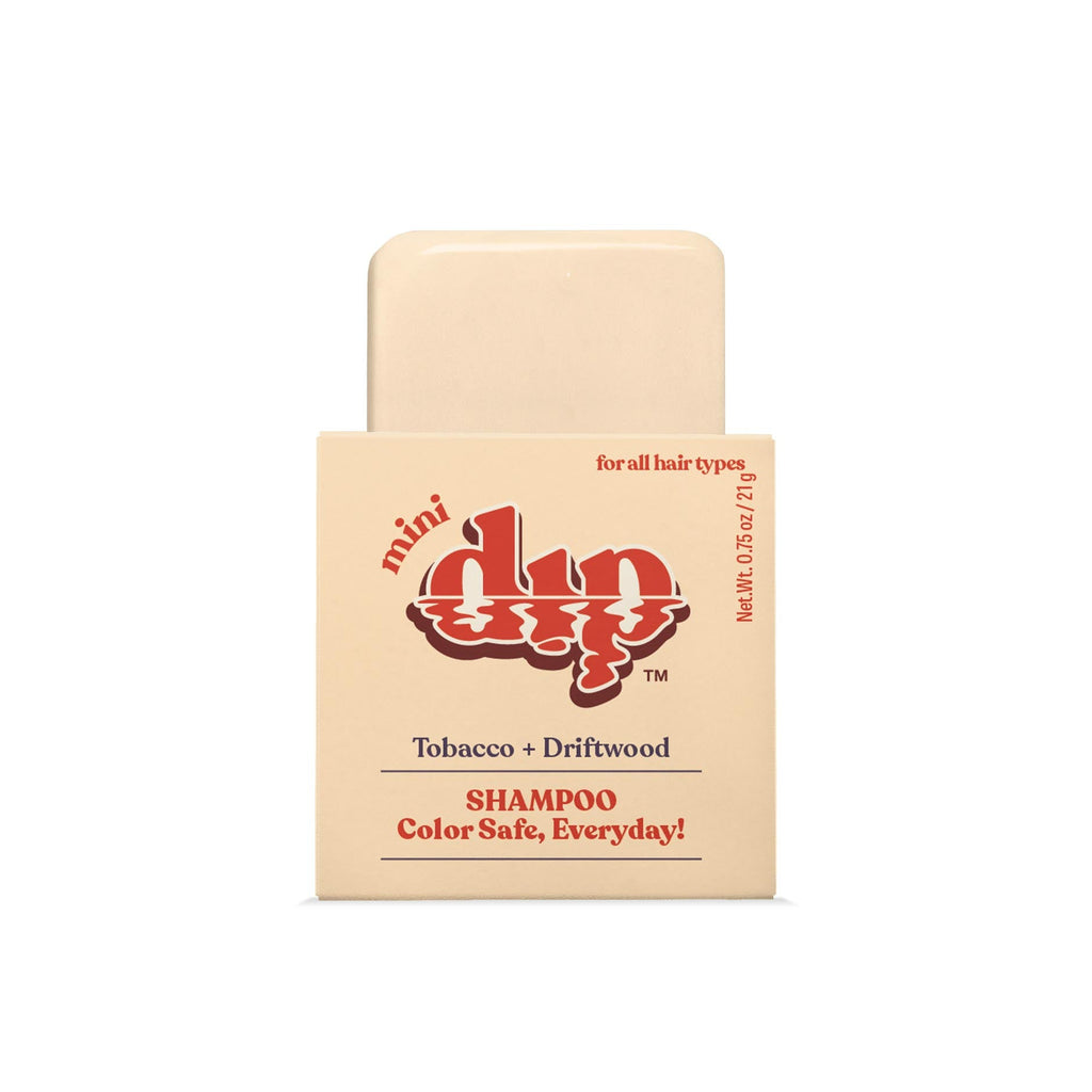 Shampoo bar with packaging labeled 'mini dip' on a white background