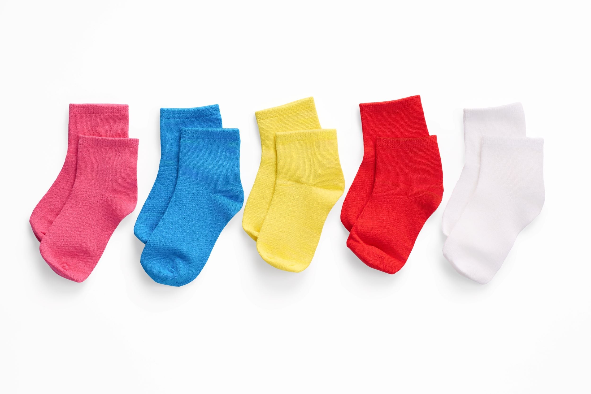 Five colorful socks (pink, blue, yellow, red, white) arranged in a row on a white background.