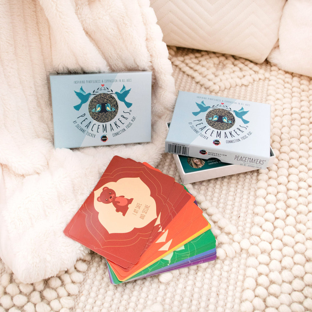 Colorful cards with a 'Peacemakers' logo on a textured surface