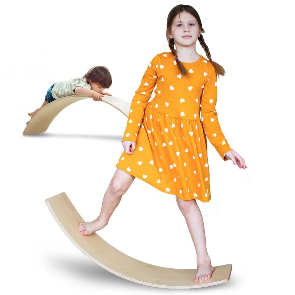 Two children playing on a wooden balance board against a white background