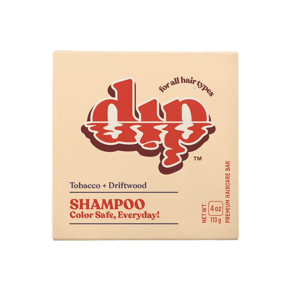 Box of shampoo with red and brown text on a beige background