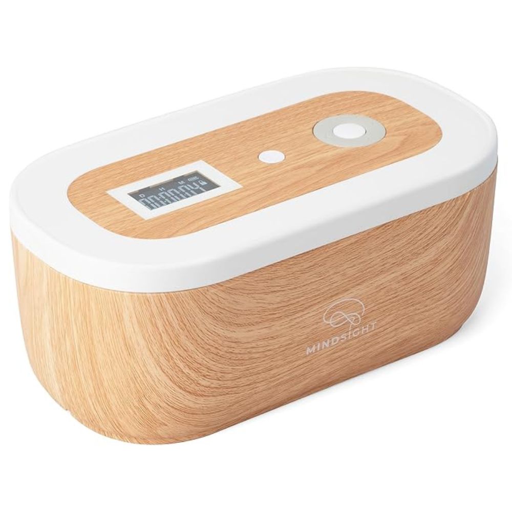 Wooden and white electronic device with a digital display on a white background