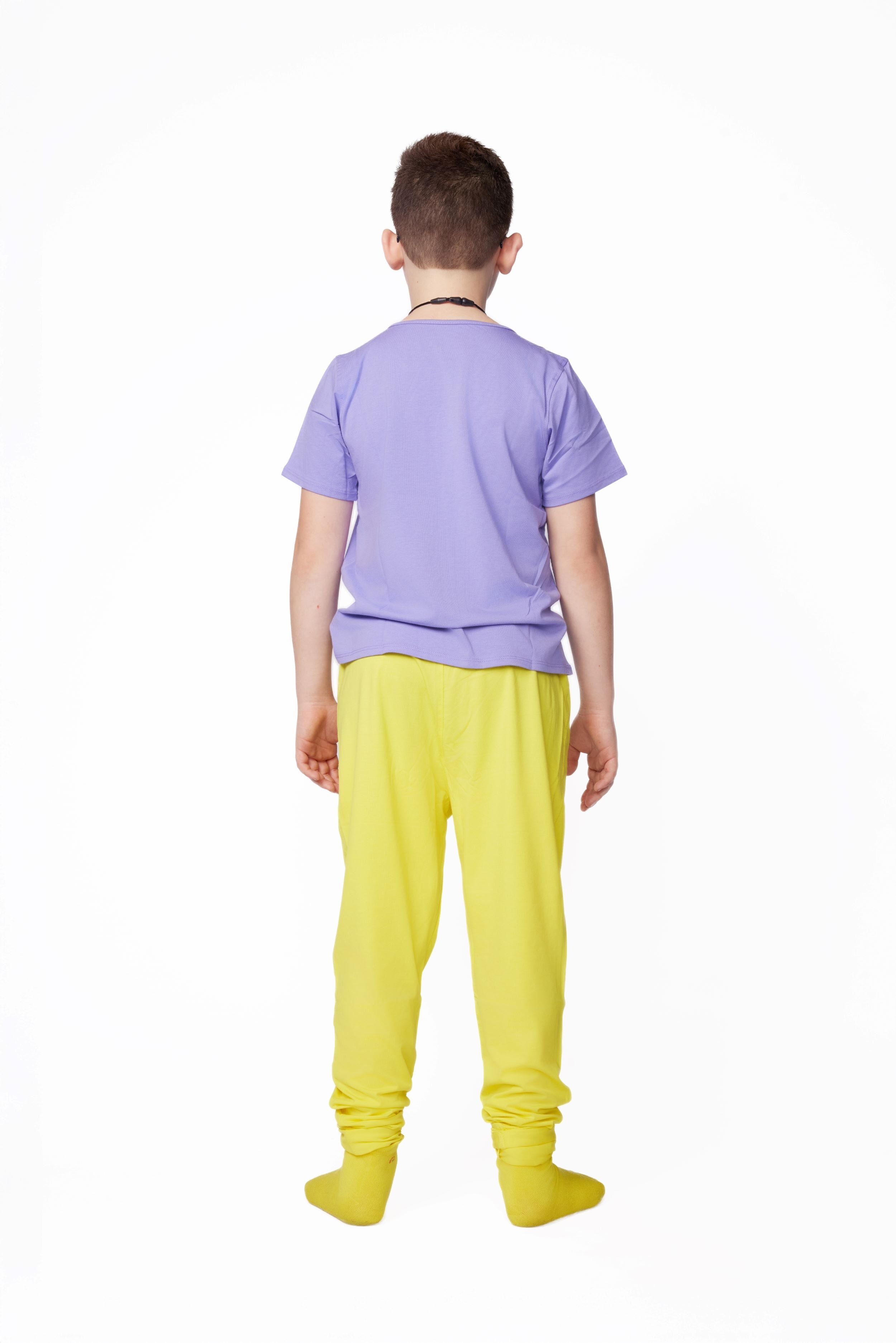 Person wearing a purple shirt and yellow pants on a white background