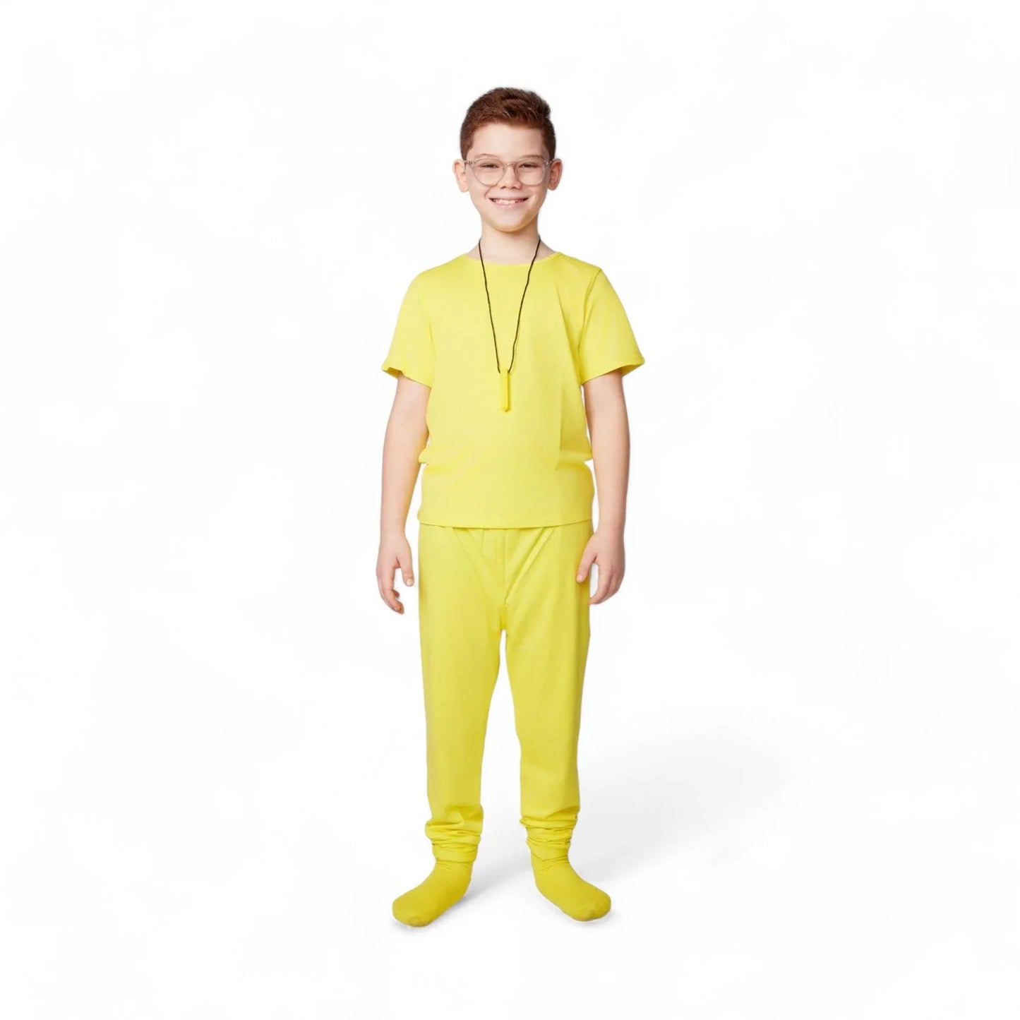 Smiling child in yellow sensory-friendly clothing with necklace on white background