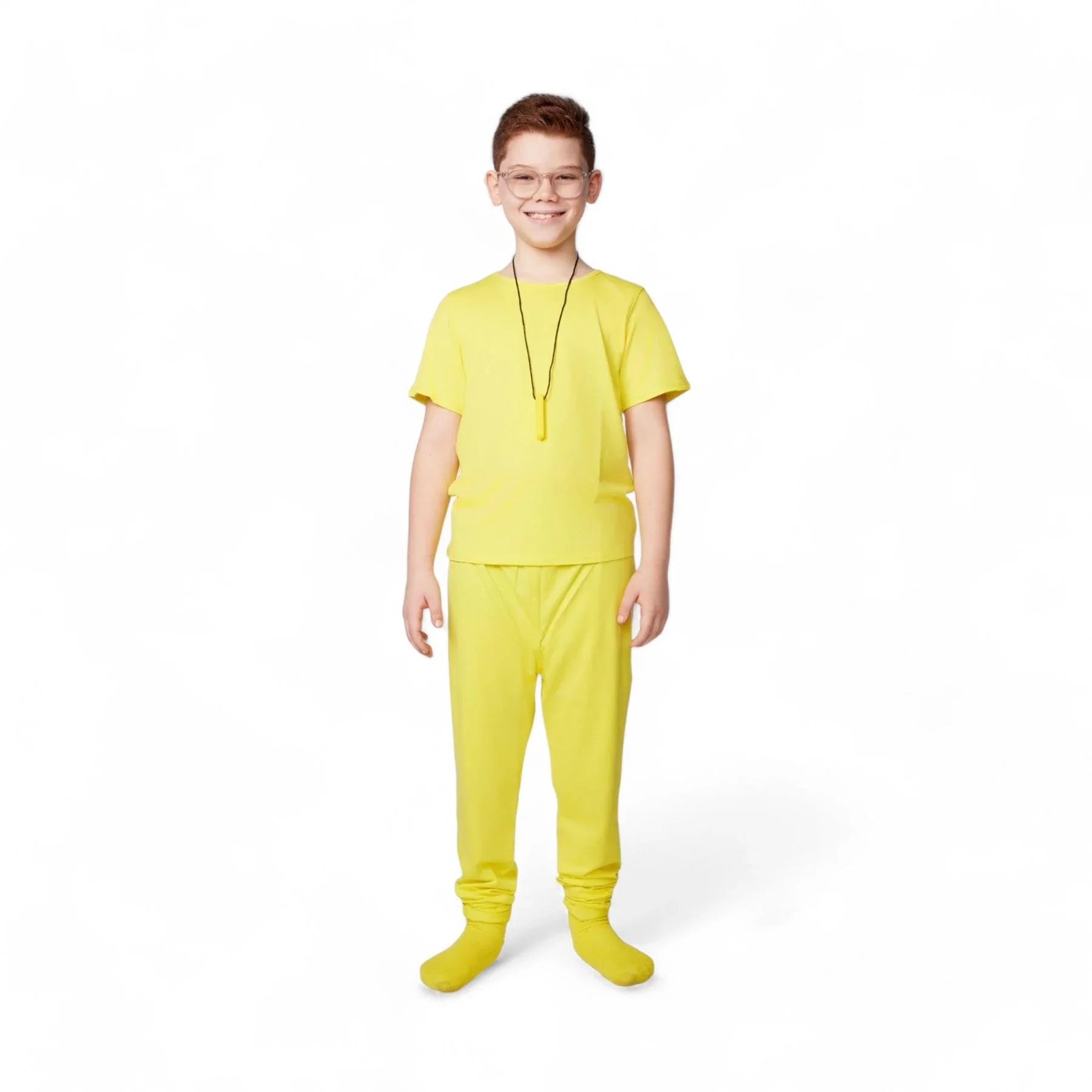 Smiling child in yellow sensory-friendly clothing with necklace on white background