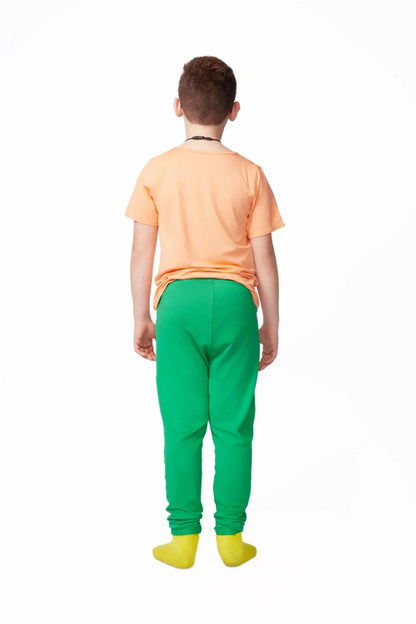 Child wearing orange t-shirt, green sensory-friendly pants, and yellow socks, back view