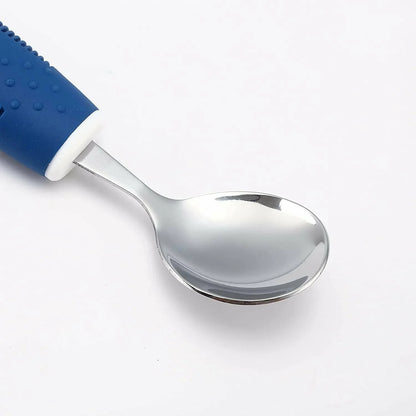 Adaptive spoon with textured blue ergonomic handle for sensory-friendly eating