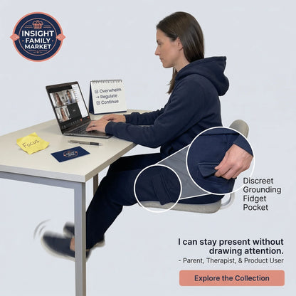 Woman in sensory-friendly hoodie using laptop, showing grounding fidget pocket for focus support.
