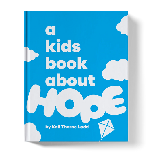 Children's book cover titled 'A Kids Book About Hope' with clouds and a kite on blue background