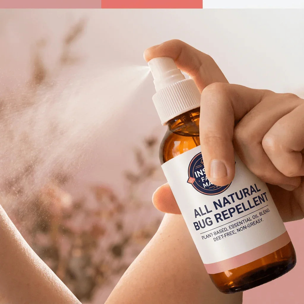 Hand spraying all natural bug repellent, plant-based essential oil blend, on skin