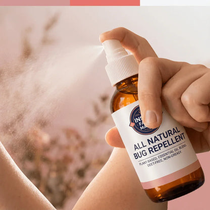 Hand spraying all natural bug repellent, plant-based essential oil blend, on skin