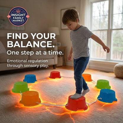 Young child balancing on colorful sensory stepping stones indoors, promoting emotional regulation and sensory play for neurodiverse support.