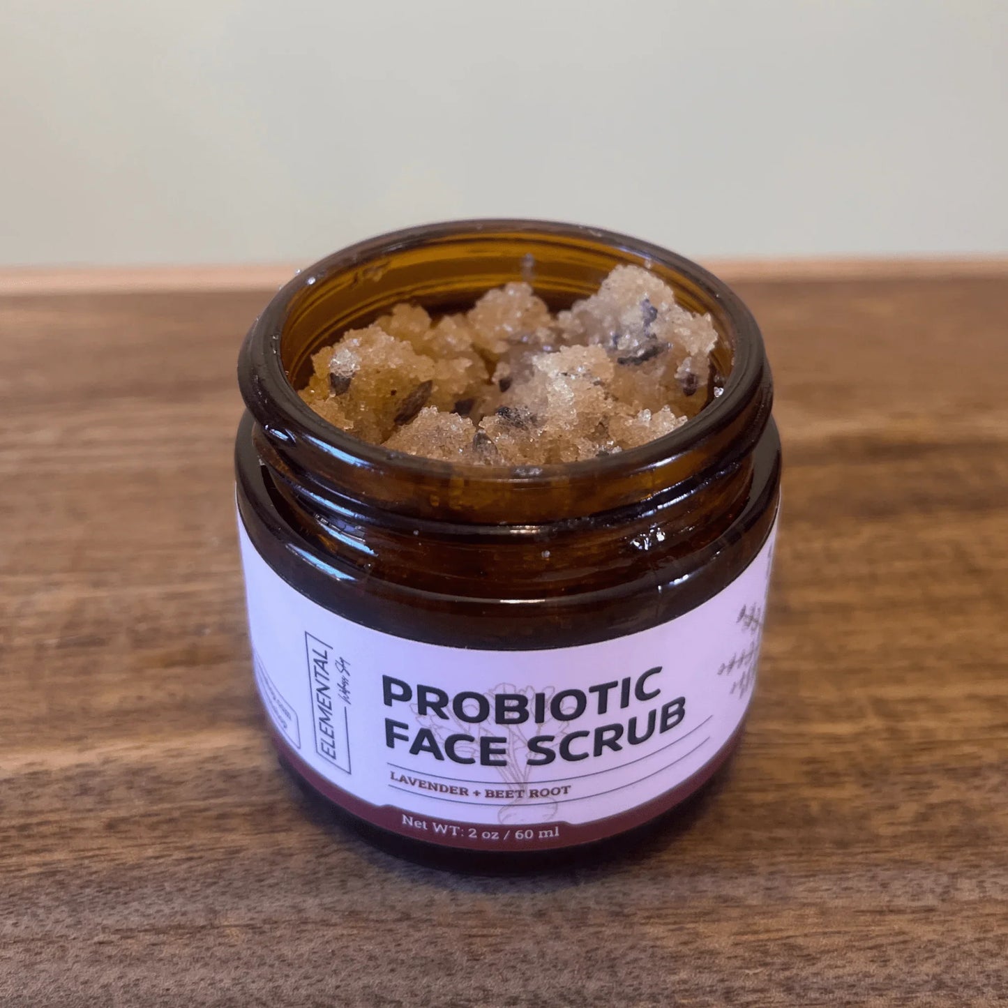 Probiotic face scrub jar with natural exfoliating crystals, lavender and beet root
