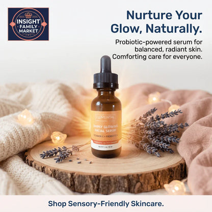 Facial serum bottle with Vitamin C and probiotics on cozy wood tray, surrounded by lavender and knit fabric, sensory-friendly skincare promotion.