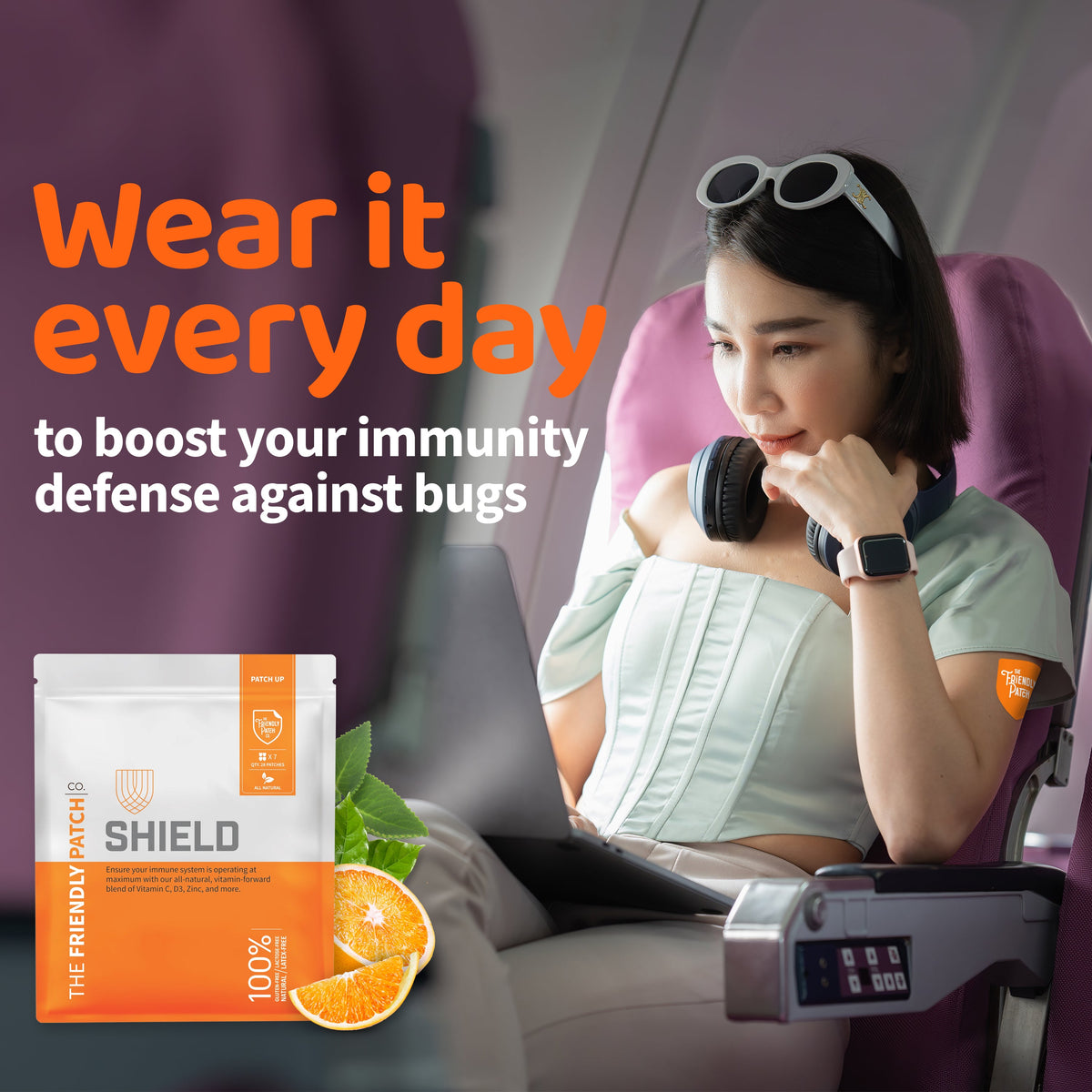 Woman using a laptop with a product package labeled 'SHIELD' and text about boosting immunity.