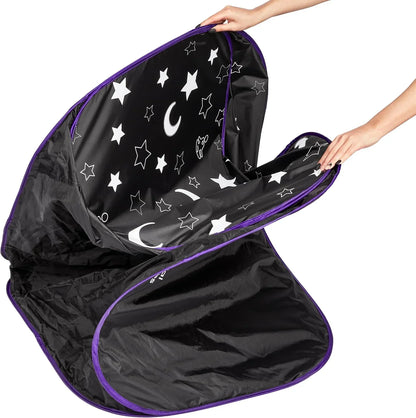 Black sensory play tent with purple trim, moon and star pattern interior, hands opening