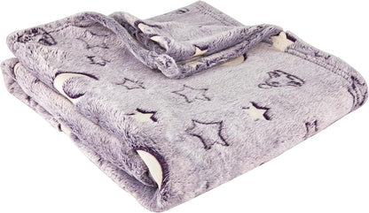 Soft grey sensory-friendly blanket with moon and star patterns, folded neatly.