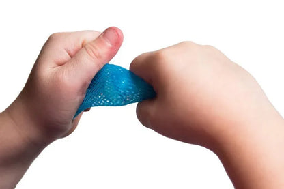 Child's hands squeezing blue sensory fidget mesh tube against white background