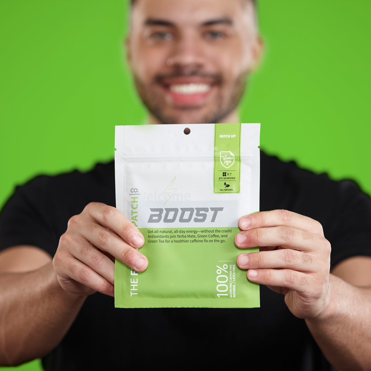 Man holding a green package labeled 'BOOST' against a green background