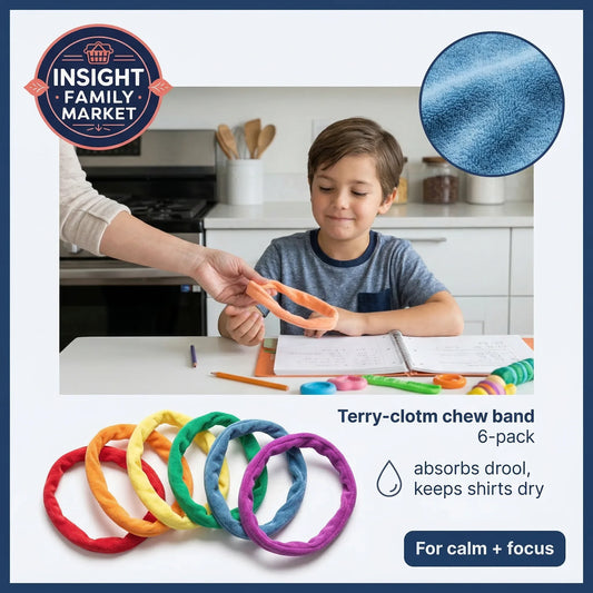Child playing with colorful chew bands in a kitchen setting, with Insight Family Market branding.
