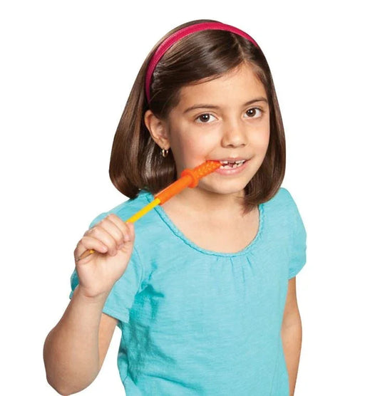 Child using orange sensory chew stick, helpful for oral sensory needs and focus support