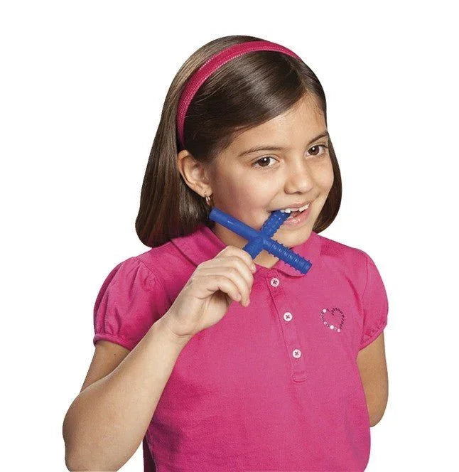 Child using blue sensory chew stick, oral motor therapy tool for sensory needs