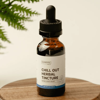 Chill Out Herbal Tincture bottle for natural calm and stress support, on wooden table