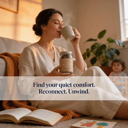 Woman enjoying herbal tea on cozy sofa, child in background, promoting relaxation and comfort.