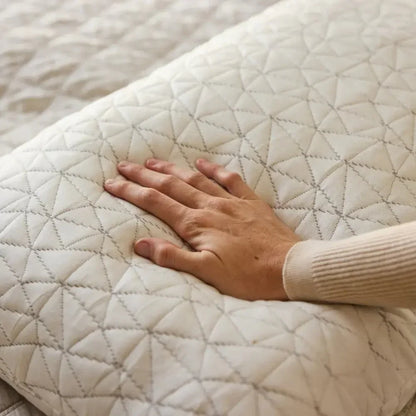 Hand pressing soft quilted pillow with geometric stitching for sensory sleep support