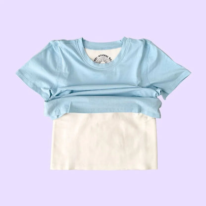 Light blue compression sensory shirt with white sensory panel on pastel background