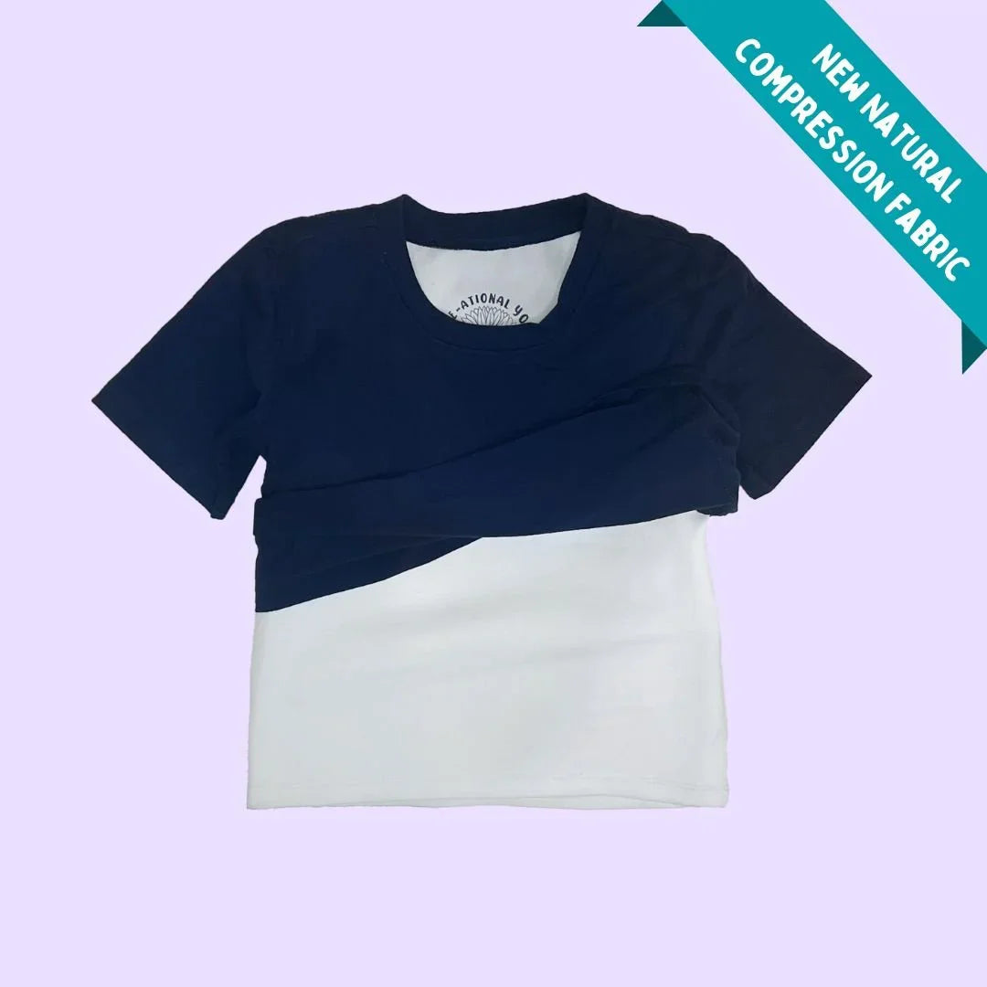 Short-sleeve navy and white sensory compression T-shirt for kids on light purple background