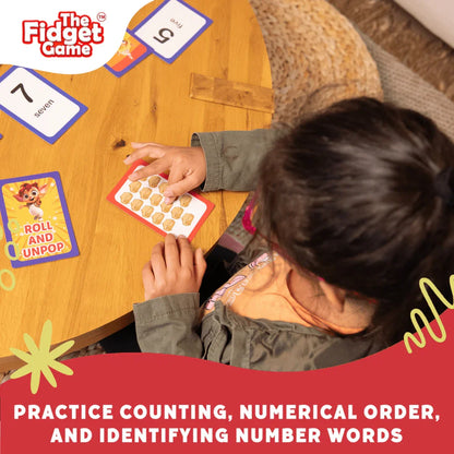 Child playing educational counting and number card game at table, practicing math skills