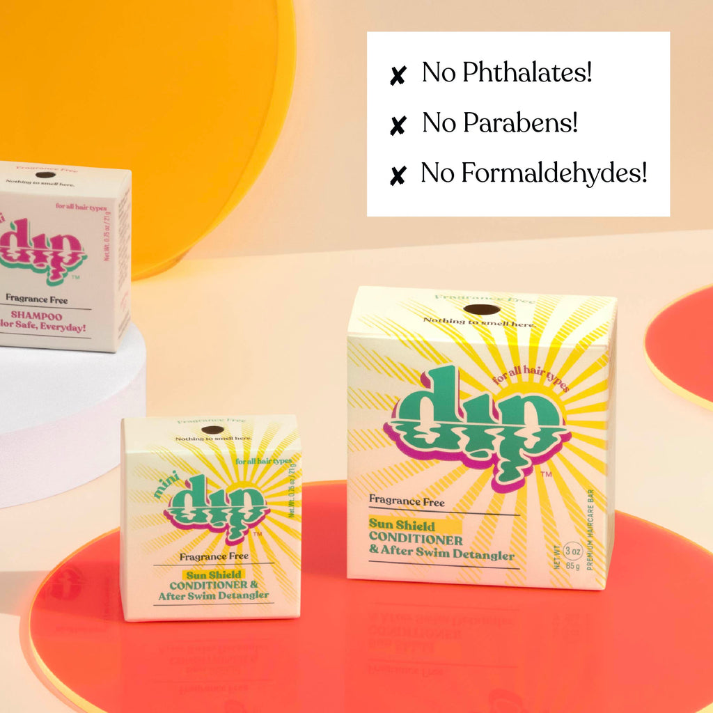 Dip hair care product boxes with safety claims on a colorful background
