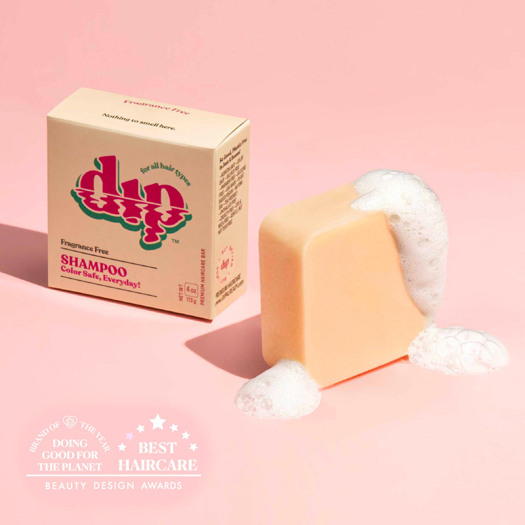 Bar of soap with a box labeled 'dup' on a pink background