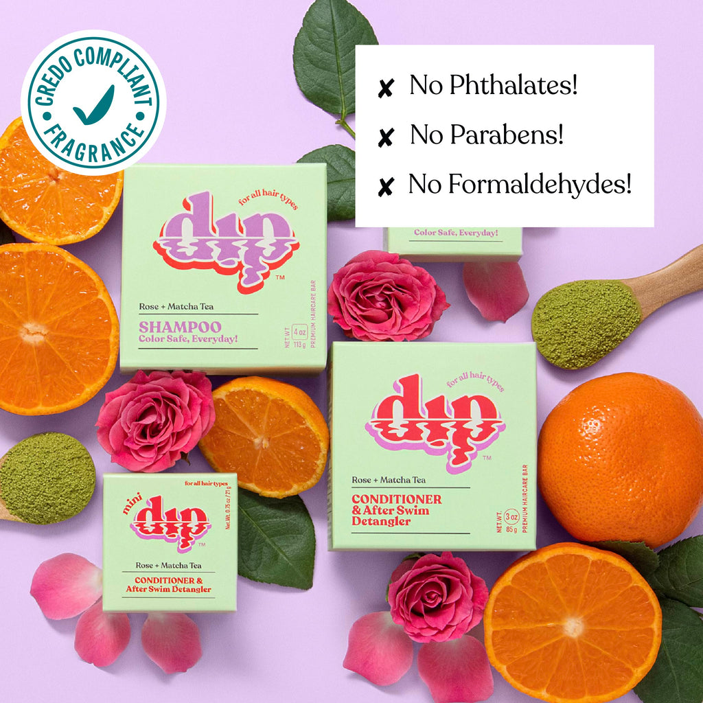 dip shampoo and conditioner boxes with oranges and roses on a purple background