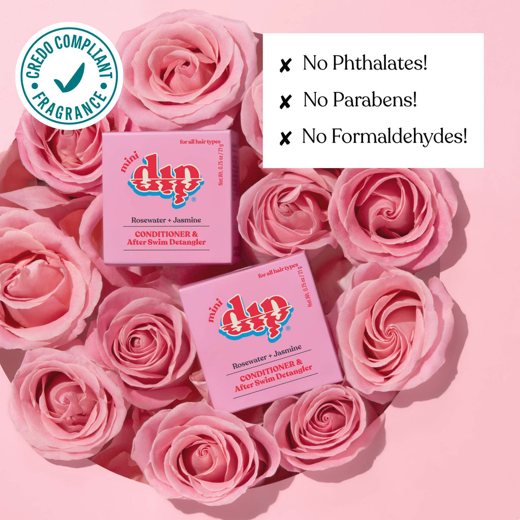 Two boxes of 'dip' products surrounded by pink roses on a pink background with greenery.