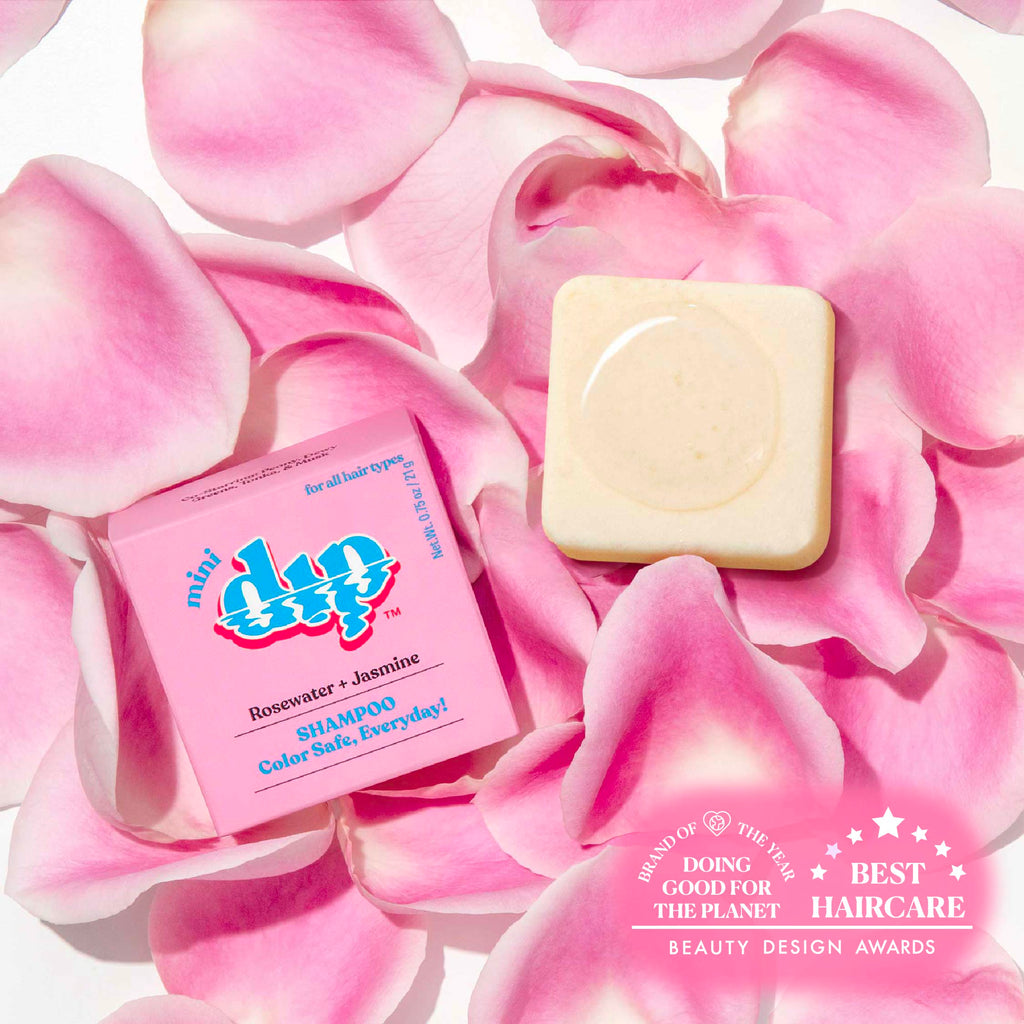 miu dip shampoo bar and soap on pink rose petals with awards text