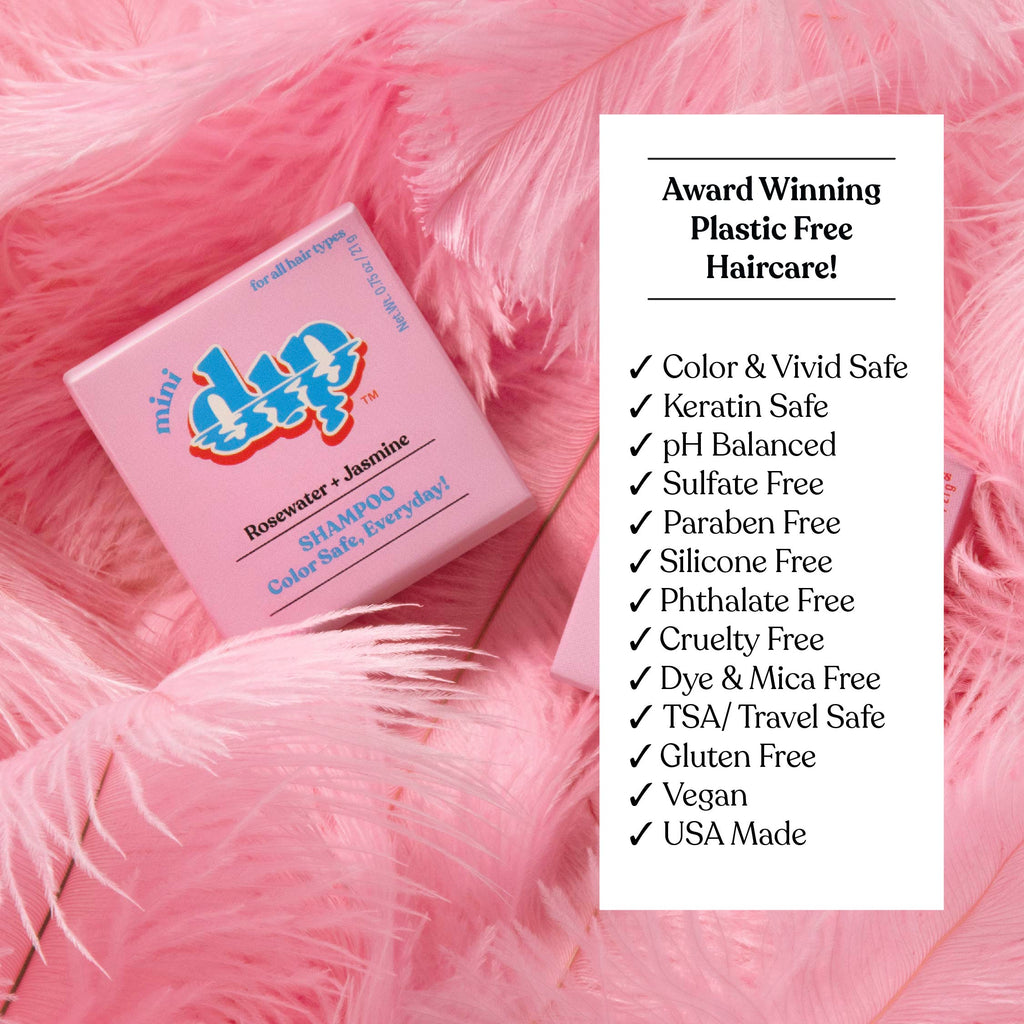 Pink hair care product box on pink feathers with text highlighting features