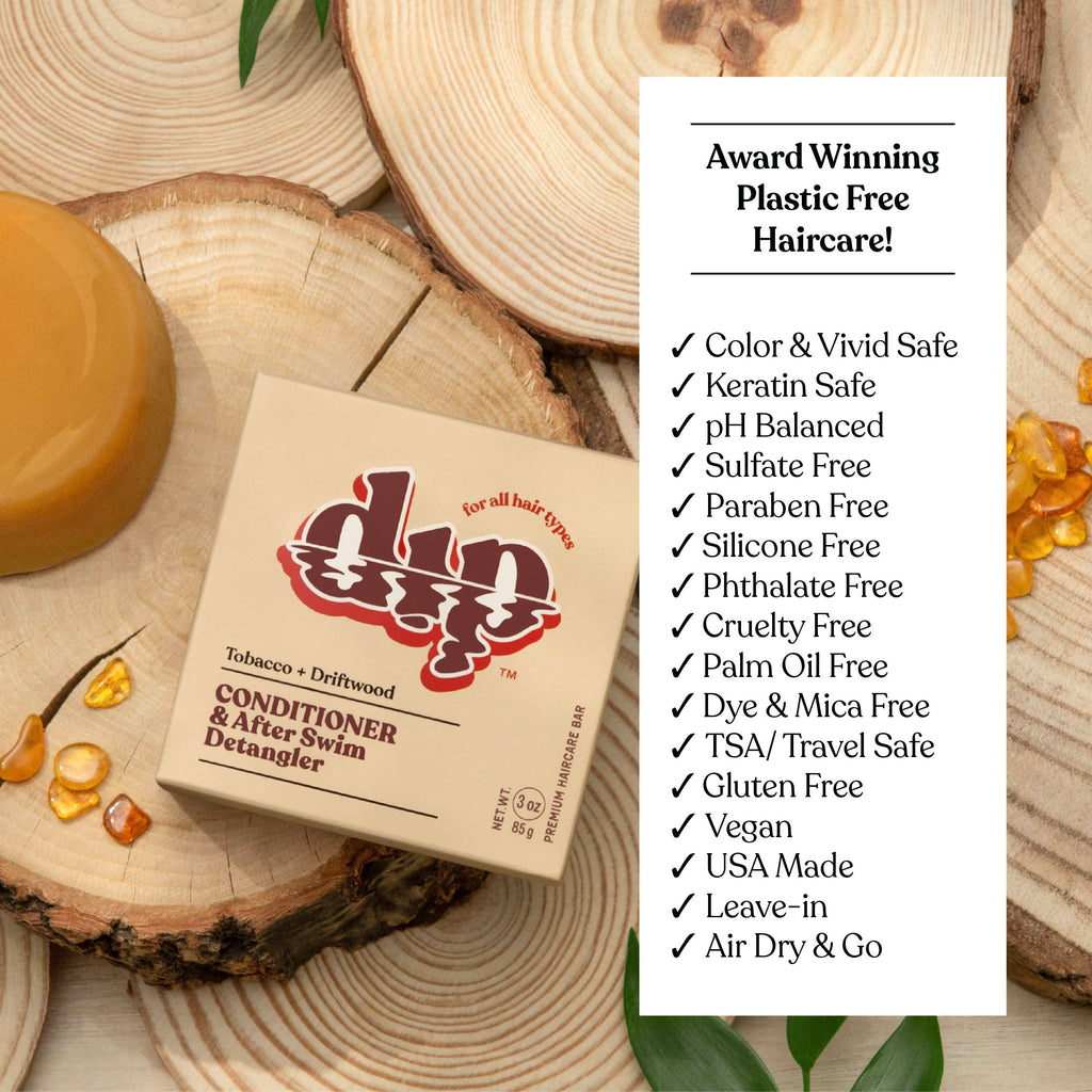 Box of 'din dip' hair care product on wooden surface with text highlighting features.